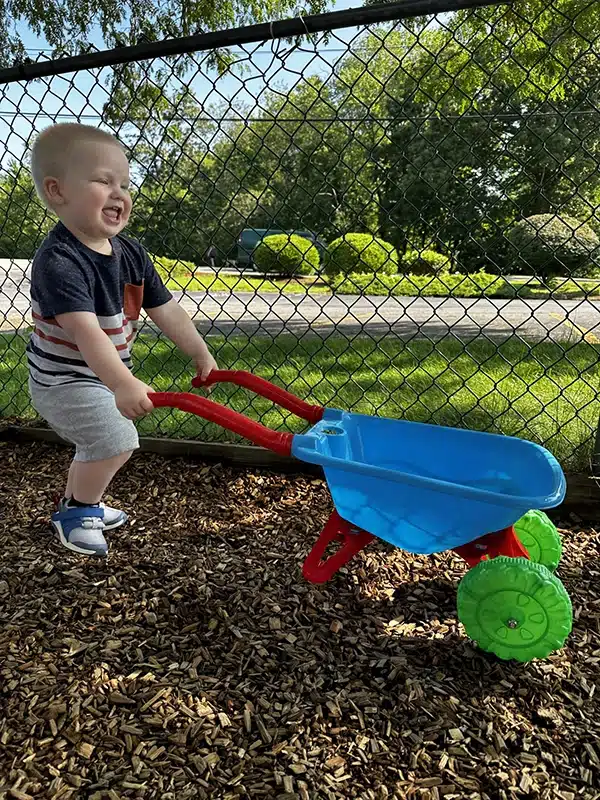 Child playing outside at Scribbletime