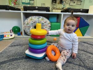 infant playing with toys